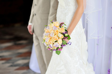 beautiful wedding bouquet at bride's hands