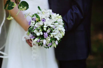 beautiful wedding bouquet at bride's hands