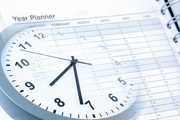 Fototapeta na wymiar Time management clock and year planner