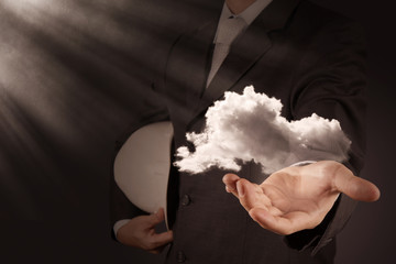 Businessman working with a Cloud Computing diagram on the new co