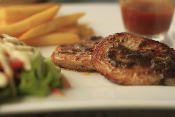 Cooked meat on a white plate