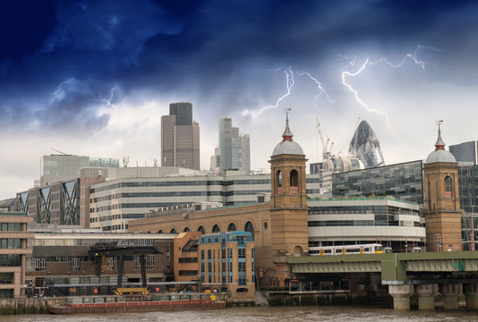 Storm over City of London, financial center and Canary Wharf at