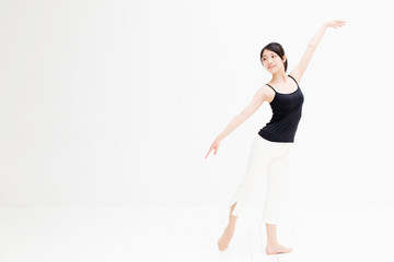 attractive asian woman exercising on white background
