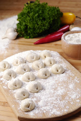 Meat dumplings on the kitchen board
