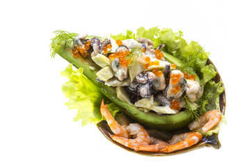 Seafood salad with red caviar in avocado