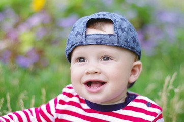 portpait of happy baby boy in summer