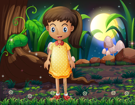 A little girl in the forest wearing a yellow dotted dress