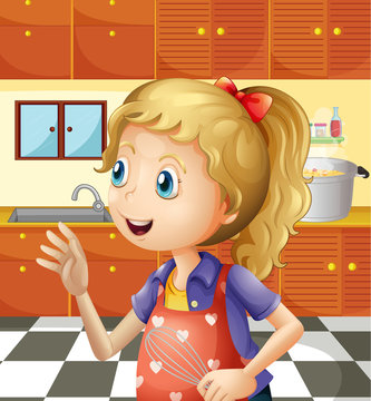 A young girl at the kitchen holding a mixer