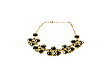 dark tone gem and gold necklace