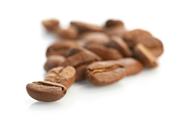 Macro of coffee beans isolated on white background