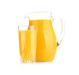 Jug, glass of orange juice and orange fruits