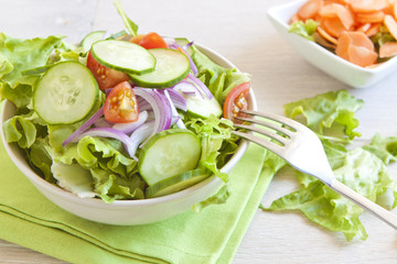 Healthy Salad with tomato, onion, cucumber and lettuce