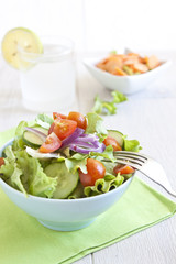 Healthy Salad with tomato, onion, cucumber and lettuce