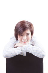 asian woman sitting on chair and smile