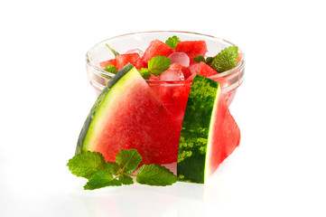 dessert with a watermelon with leaflets of mint.