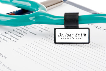 Medical questionnaire with stethoscope and ID tag