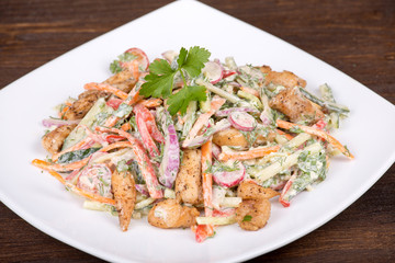 Vegetable salad with chicken in cream sauce