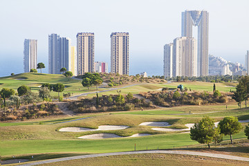 Golf field with skyscrapers in the city of Benidorm, Spain