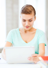 smiling student girl with tablet pc