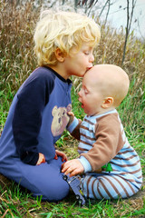 Child Kissing Baby Brother
