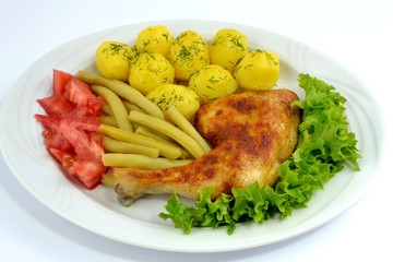 grilled chicken leg with potatoes and green beans