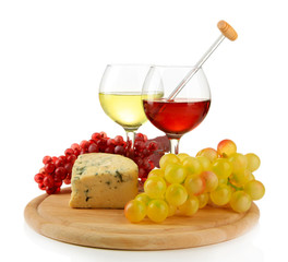 Glasses of wine, tasty blue cheese and grape