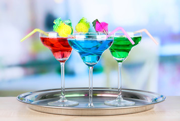 Different cocktails on bright background