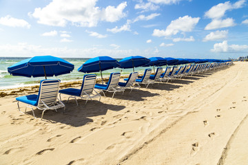 umbrellas and empty beach couches at the beach