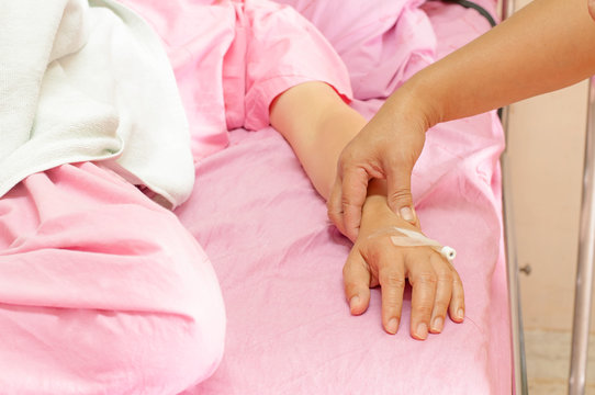 Closeup of female nurses pulse in the hands of patients