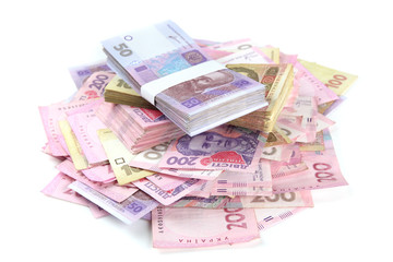 Obraz na płótnie Canvas Pile of Ukrainian money, isolated on white