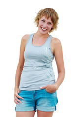 Fototapeta premium Casual woman smiling and puts hand inside pocket of denim jeans