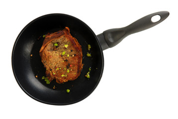 Piece of fried meat on pan isolated on white