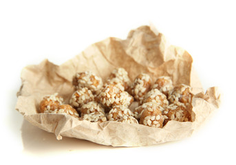 Tasty peanuts with sesame and caramel, isolated on white