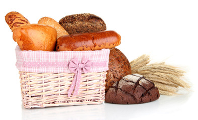 Baked bread in wicker basket isolated on white