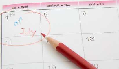 Closeup photo of pencil on calenda