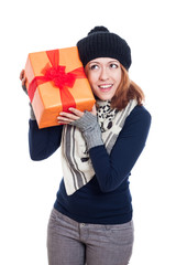 Happy curious winter woman with present