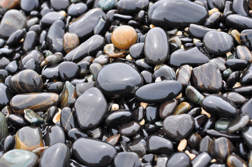 Closeup textured pattern of colorful rocks.