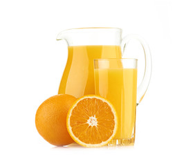 Jug, glass of orange juice and orange fruits