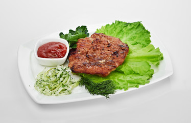 Grilled steak on a white plate