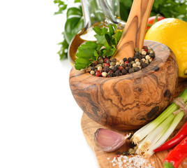 Spices, wooden mortar and vegetables