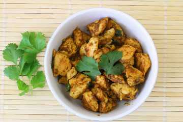 Spicy chicken with curry and coriander