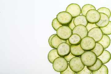 Freshly sliced cucumber  isolated on white background