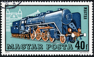 Fototapeta na wymiar stamp printed in Hungary shows a locomotive