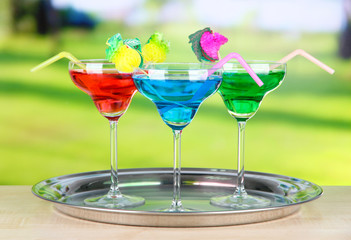 Different cocktails on bright background