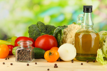Fresh vegetables in basket on wooden table on natural