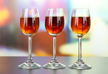 Glass of amaretto liquor, on bright background