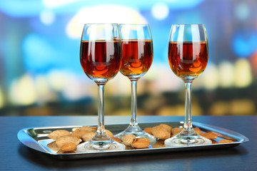 Glasses of amaretto liquor and roasted almonds,