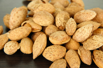 Almond on dark wooden background