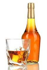 Glasses of whiskey with bottle, isolated on white