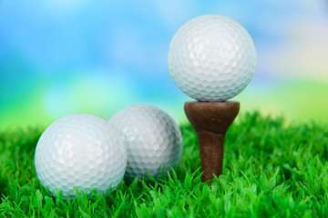 Golf ball  on green grass outdoor close up